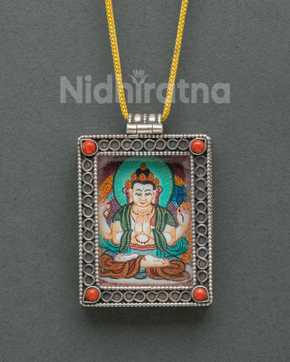 Chenrezig locket silver buddhist pendant with coral stones and floral filigree.