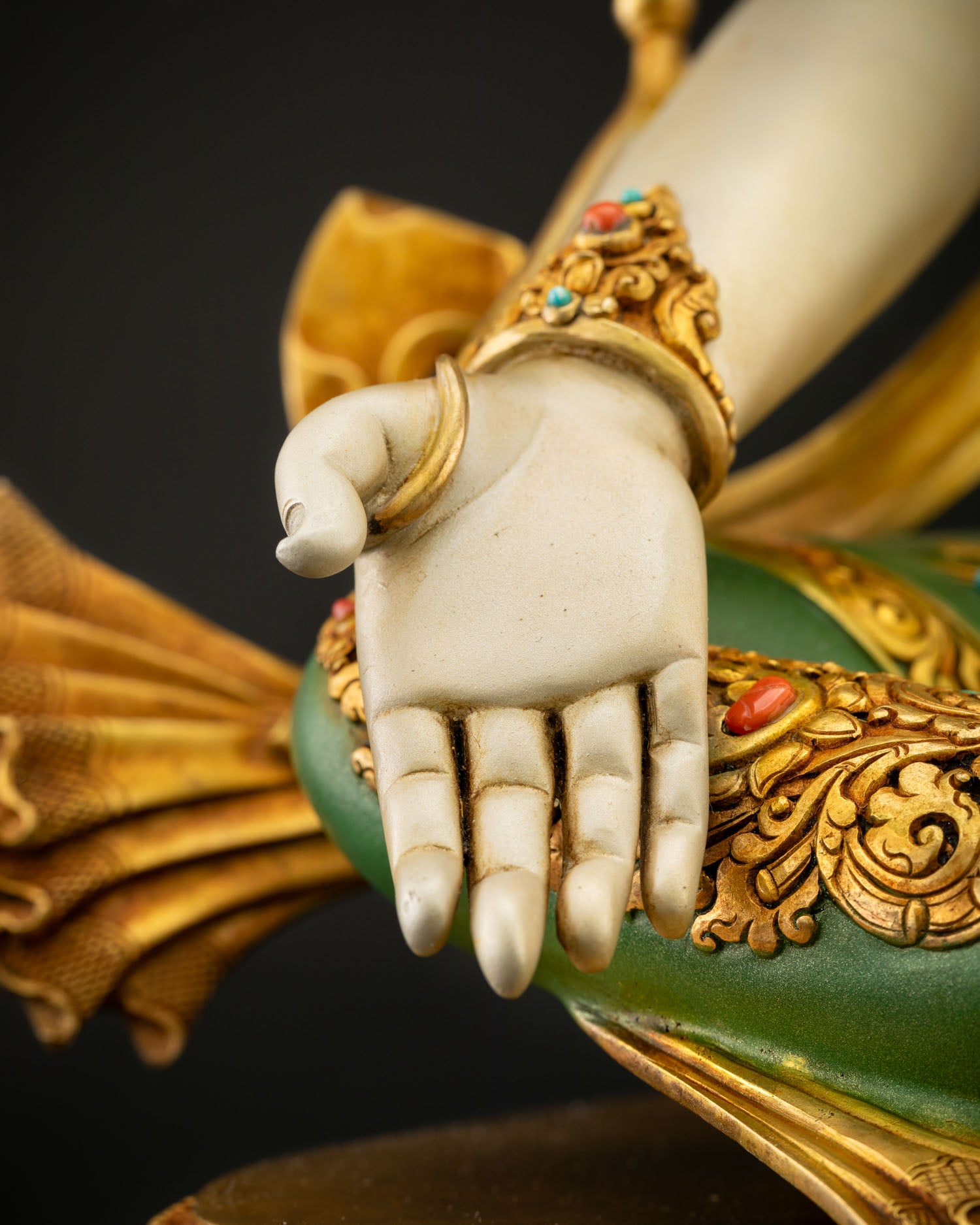 Chenrezig right hand in Varada Mudra gesture of giving, close-up detail, Nepalese Buddhist Statue