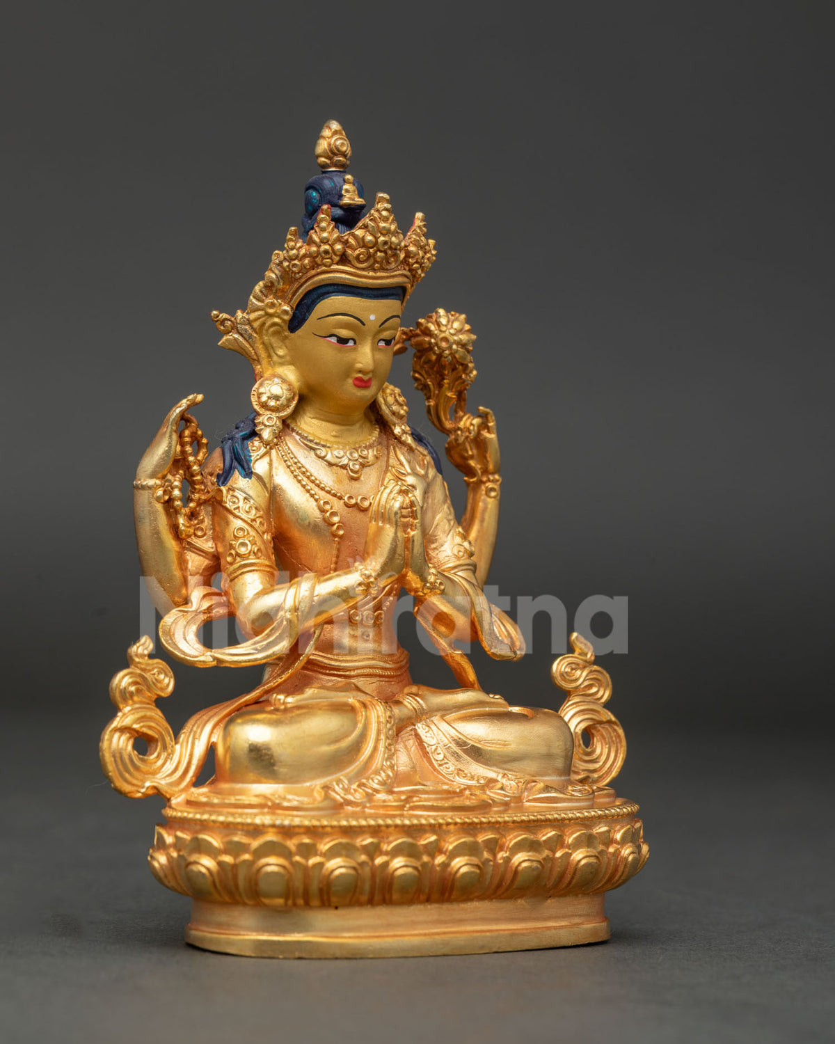 Chenrezig seated on hand carved lotus pedestal with Anjali Mudra holding wish fulfilling jewel.