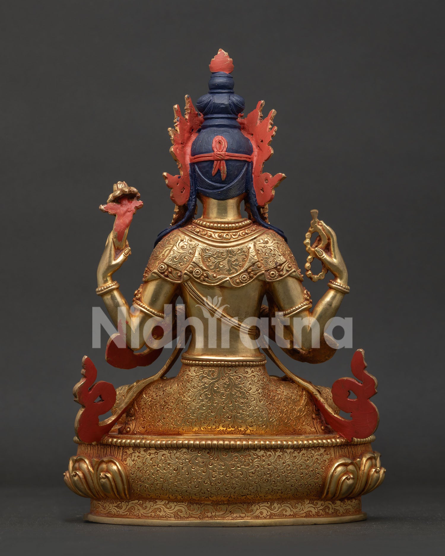 Chenrezig statue back view showing hand carved silk garment and traditional Nepalese artistry.