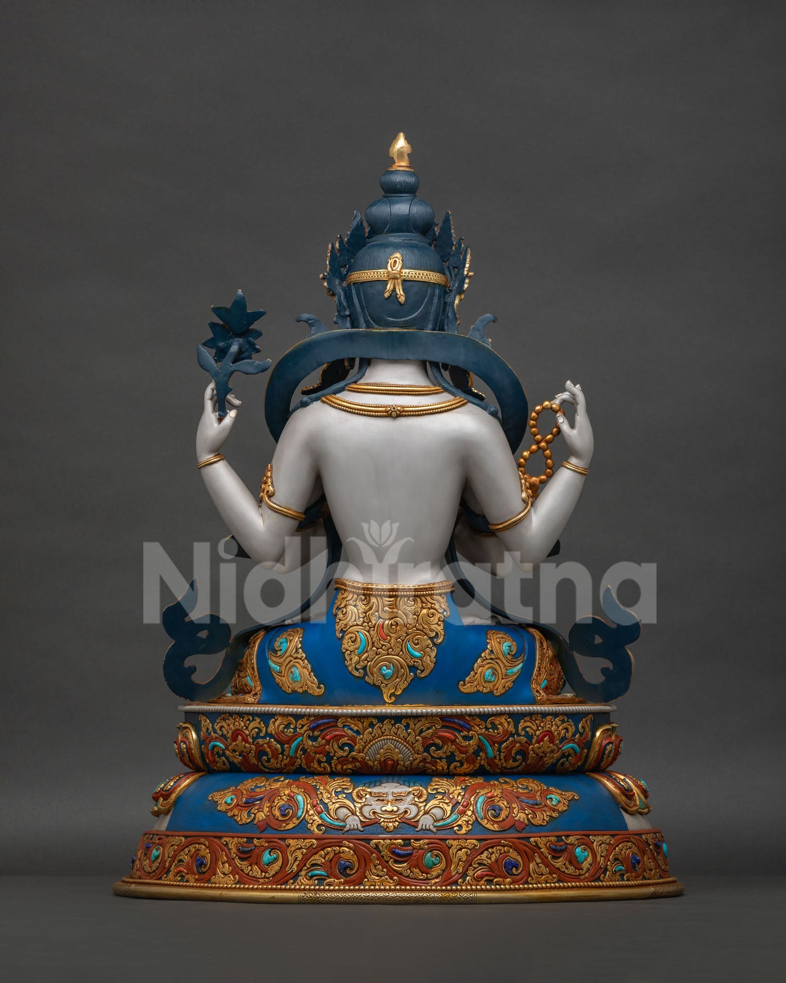 Chenrezig statue Jeju, back view showing ornate lotus pedestal and decorative Kirtimukha detail