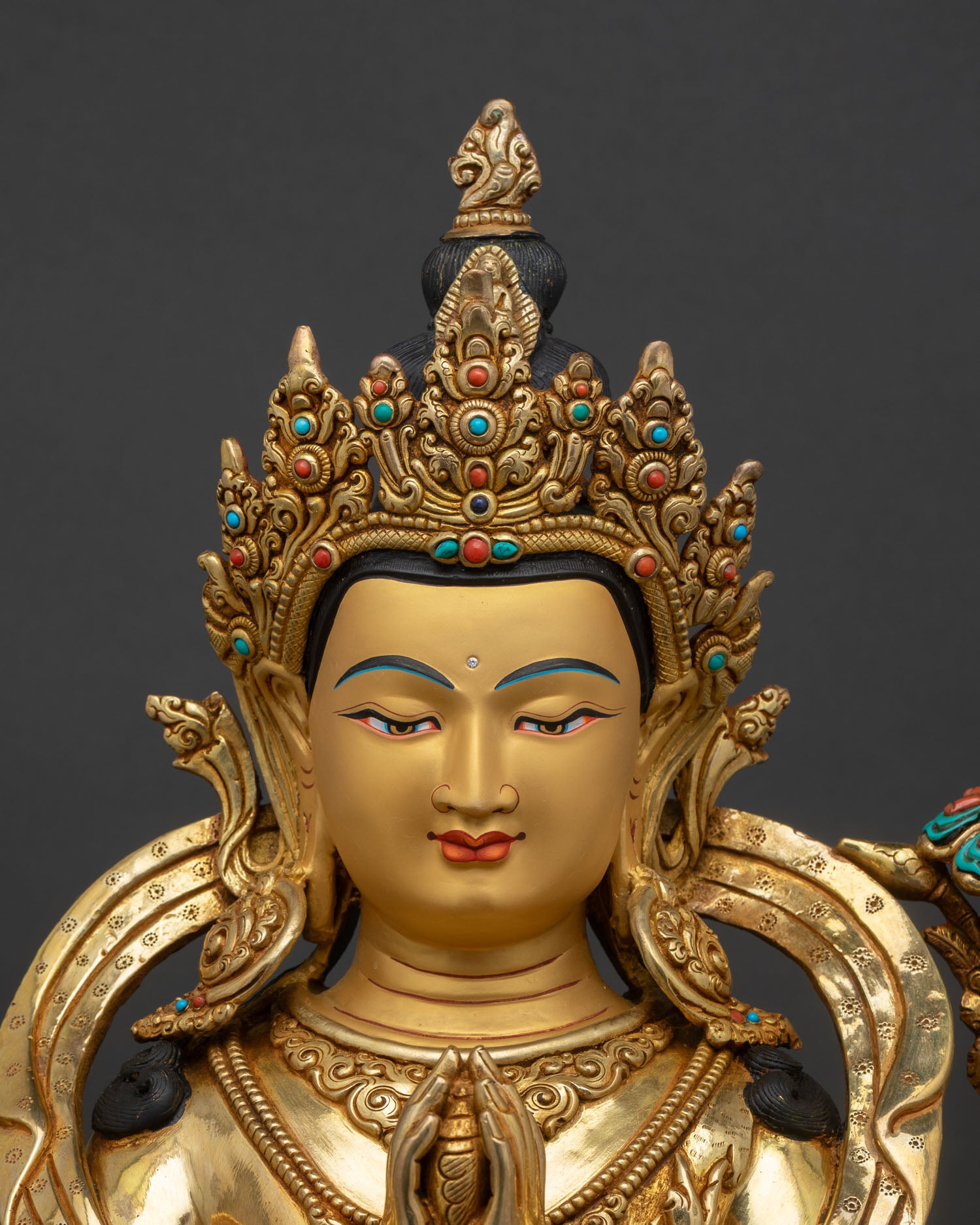 chenrezig statue close up handcrafted buddhist sculpture gold gilded copper