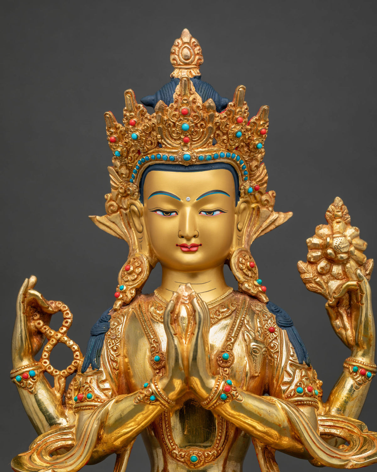 Chenrezig Statue close up semi precious stones and floral motifs.
