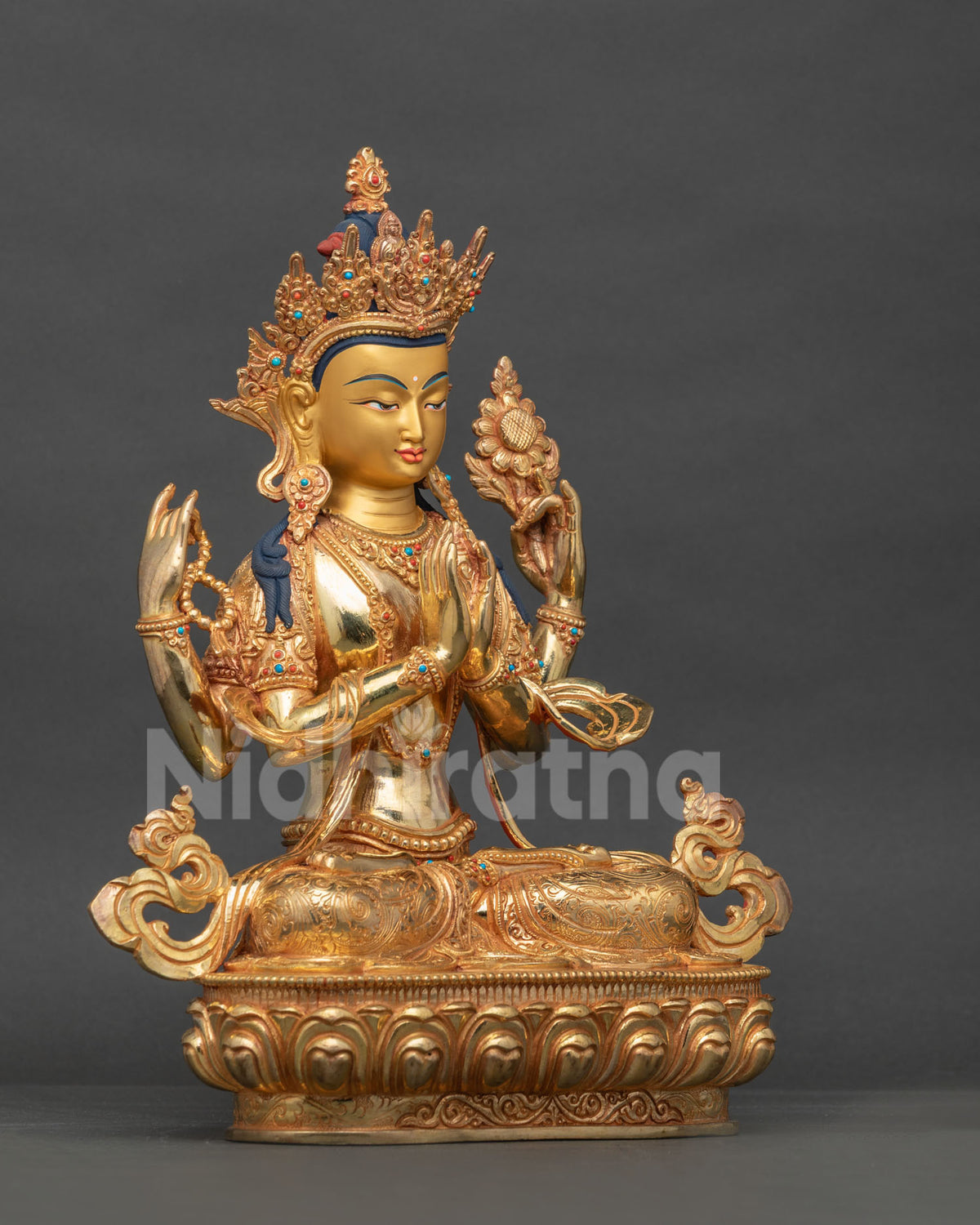 Chenrezig statue is depicted with anjali mudra crystal rosary and blooming lotus.