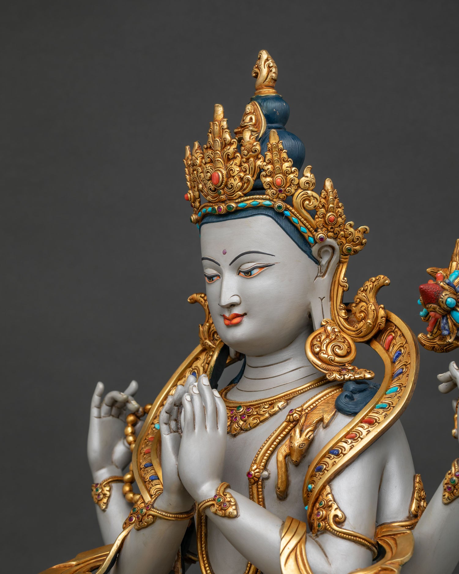 Chenrezig statue North Gyeongsang detailed side close up showing four arms, lotus, ornaments and gold gilding