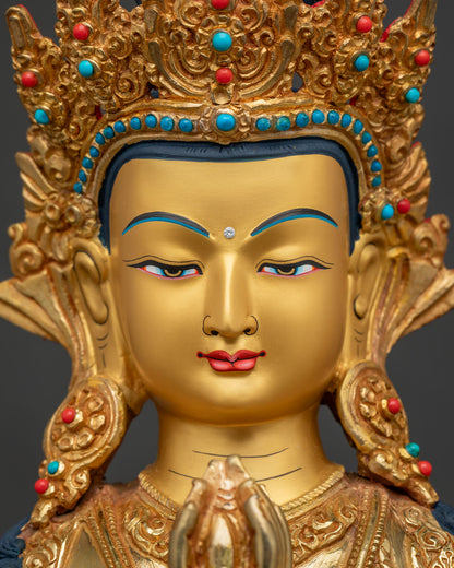 Chenrezig Statue face close up 24k gold painted face and jewelry.