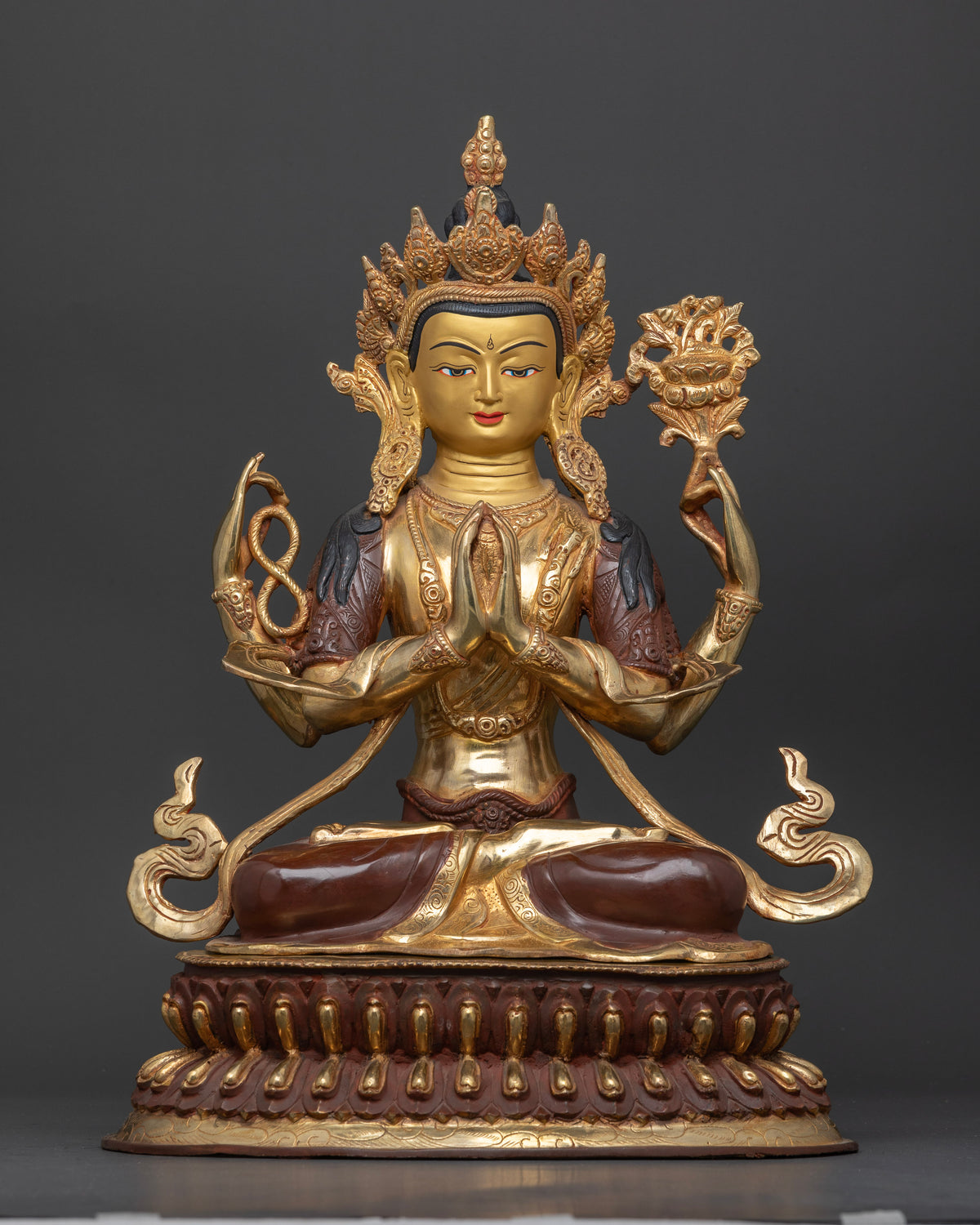 Chenrezig statue handcrafted by newari artists from patan nepal copper oxidized gold fire gilded.