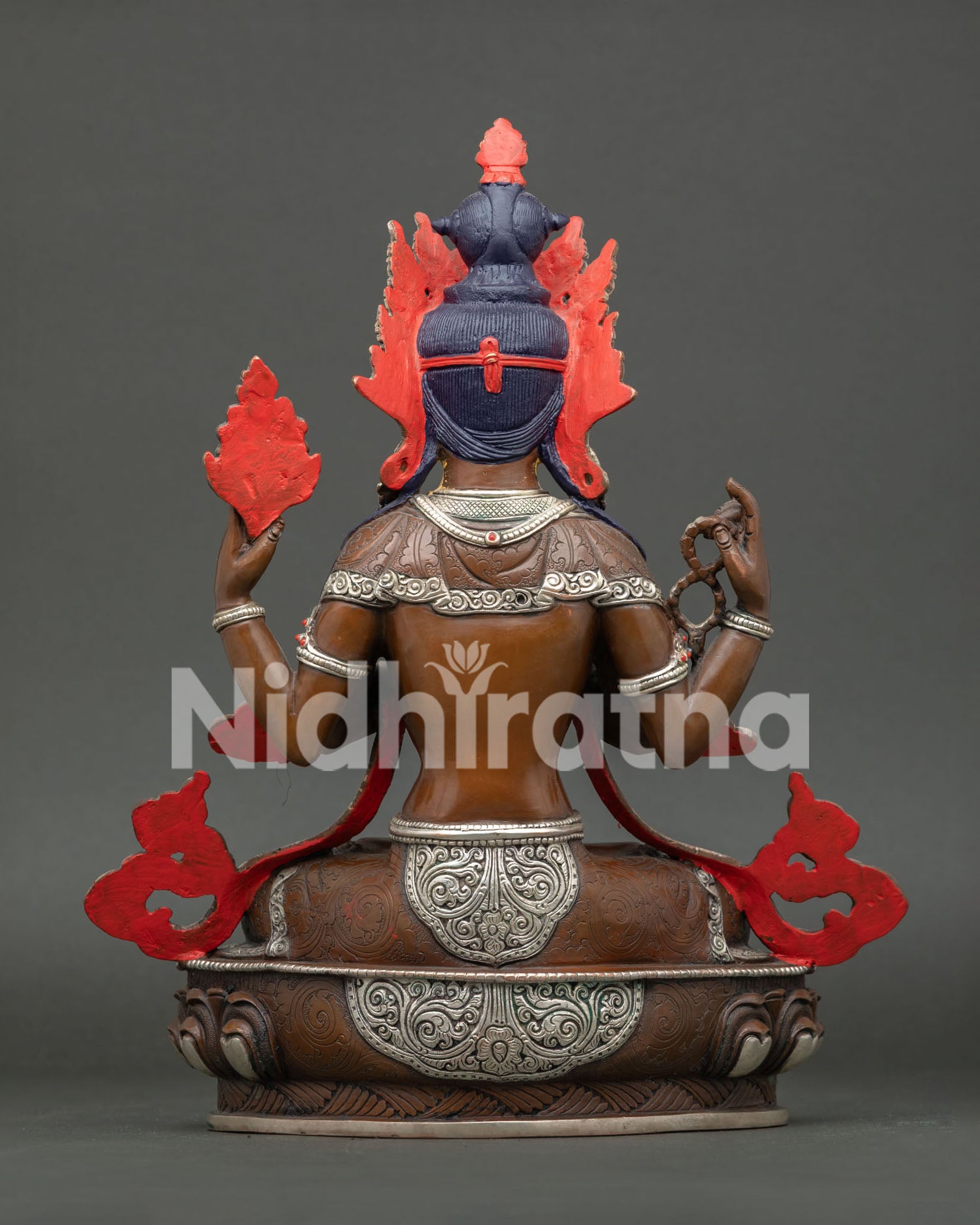 Chenrezig statue handcrafted in Nepal, copper silver-plated Buddhist sculpture on lotus throne.