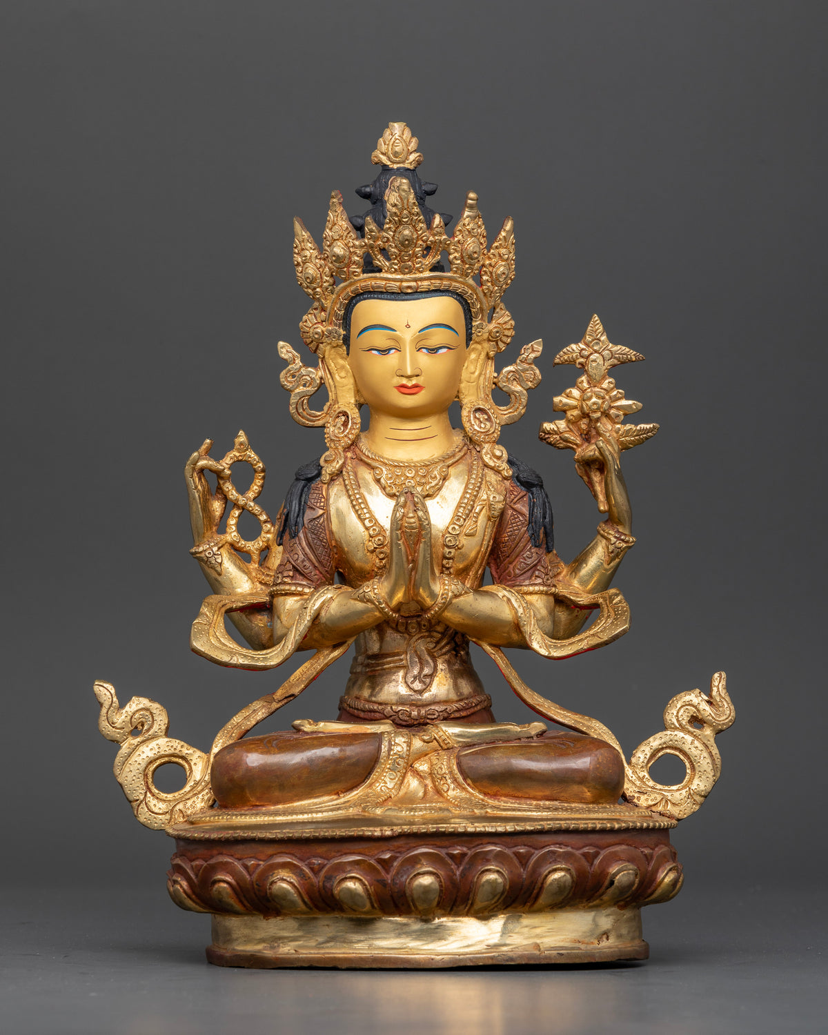 Chenrezig statue handcrafted in Patan Nepal with copper body 24K gold face and lotus pedestal.
