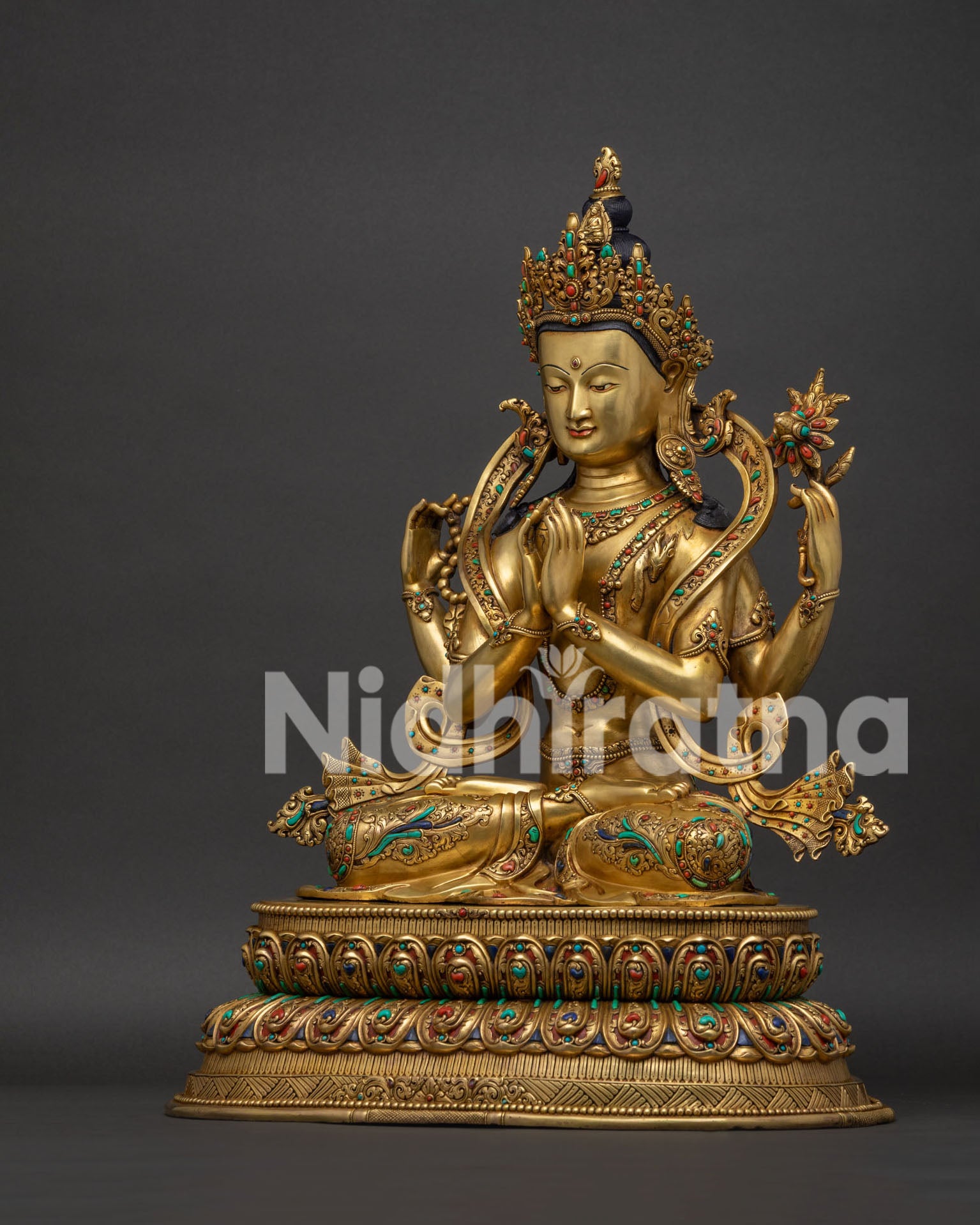 chenrezig statue left side view lotus bloom and wish fulfilling jewel gold gilded nepal sculpture