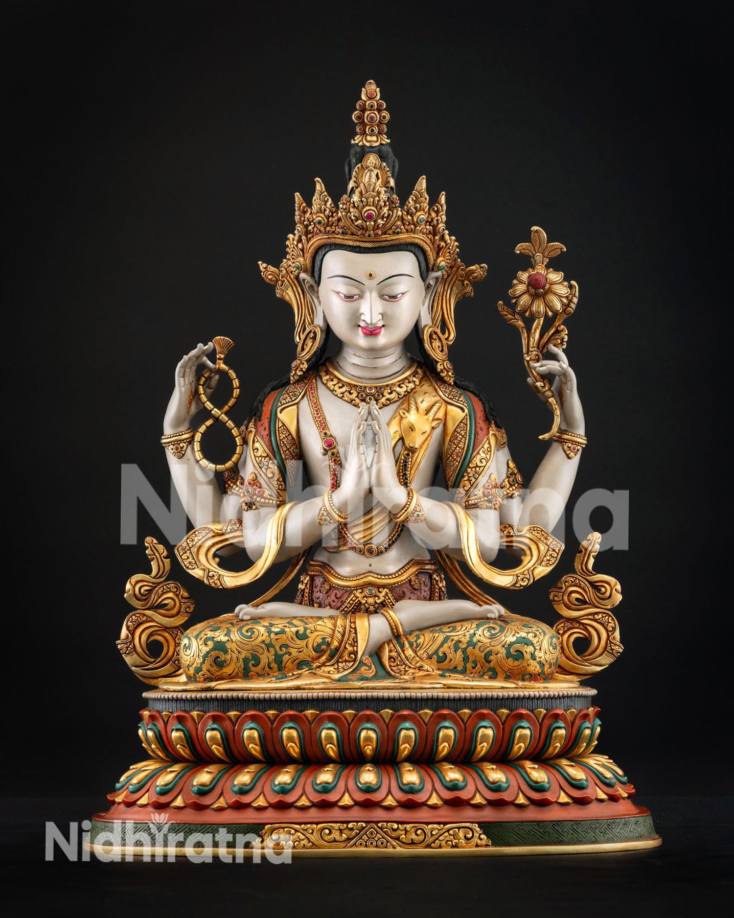 Chenrezig statue on lotus seat radiating compassion wisdom and spiritual presence in sacred Buddhist art form