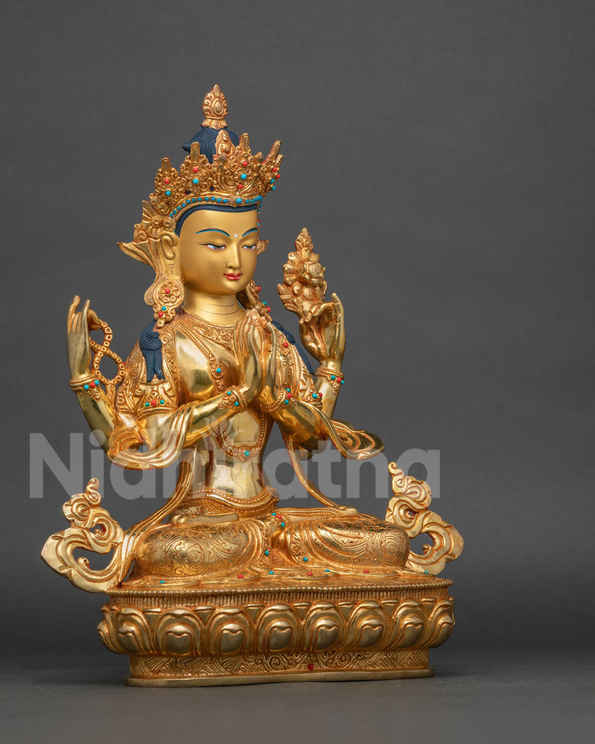 Chenrezig Statue right side view crystal rosary and blooming lotus.