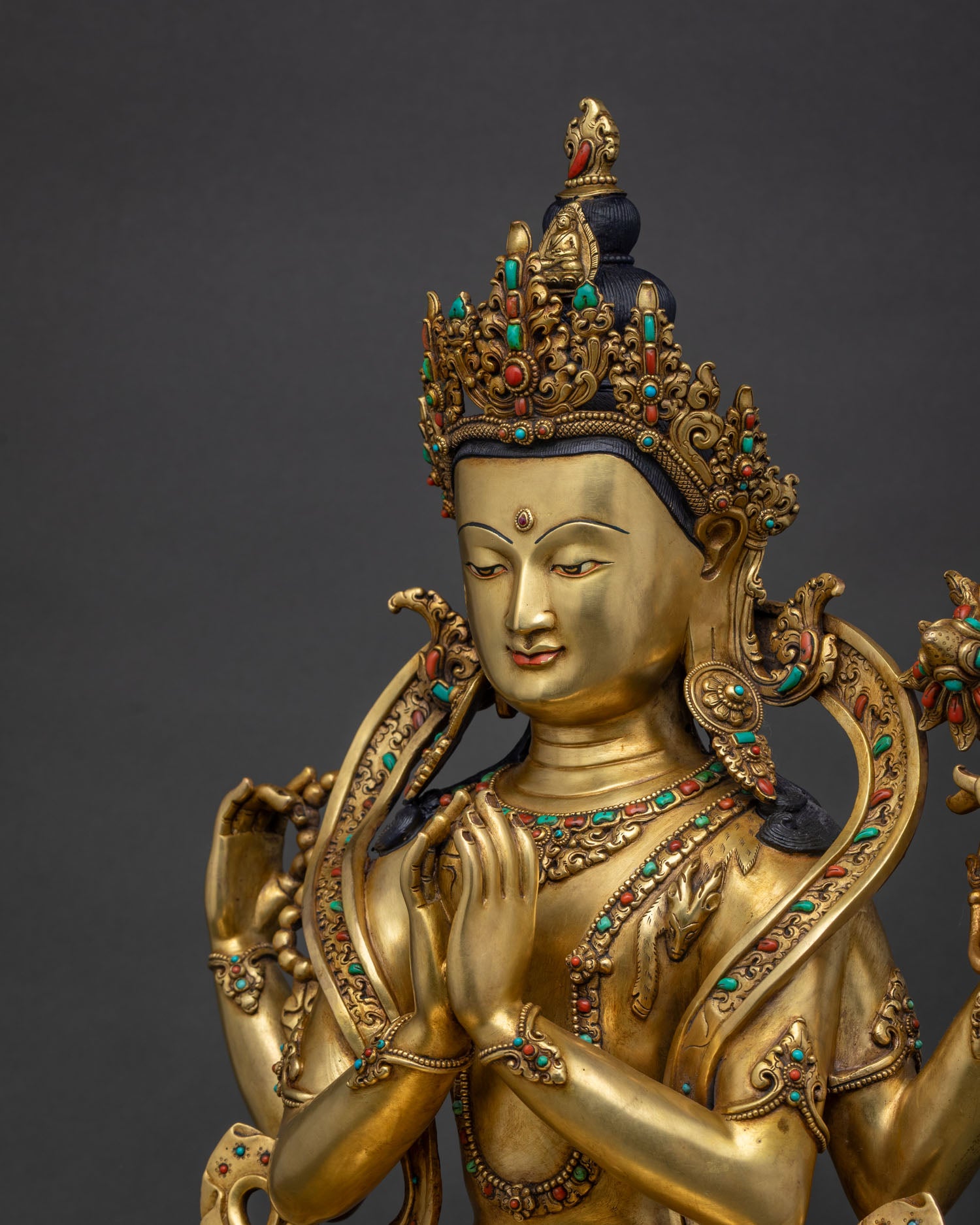 chenrezig statue side close up hand chased robes and semi precious stone inlay newari craftsmanship