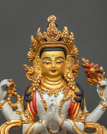 Chenrezig statue with 24K gold painted face and gilded details.