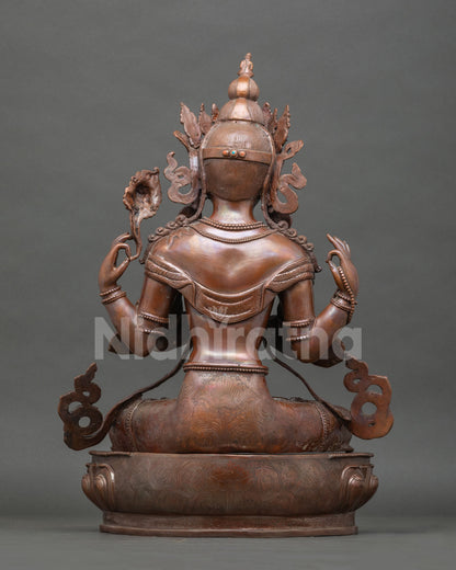 Chenrezig statue with anjali mudra crystal rosary and blooming lotus.