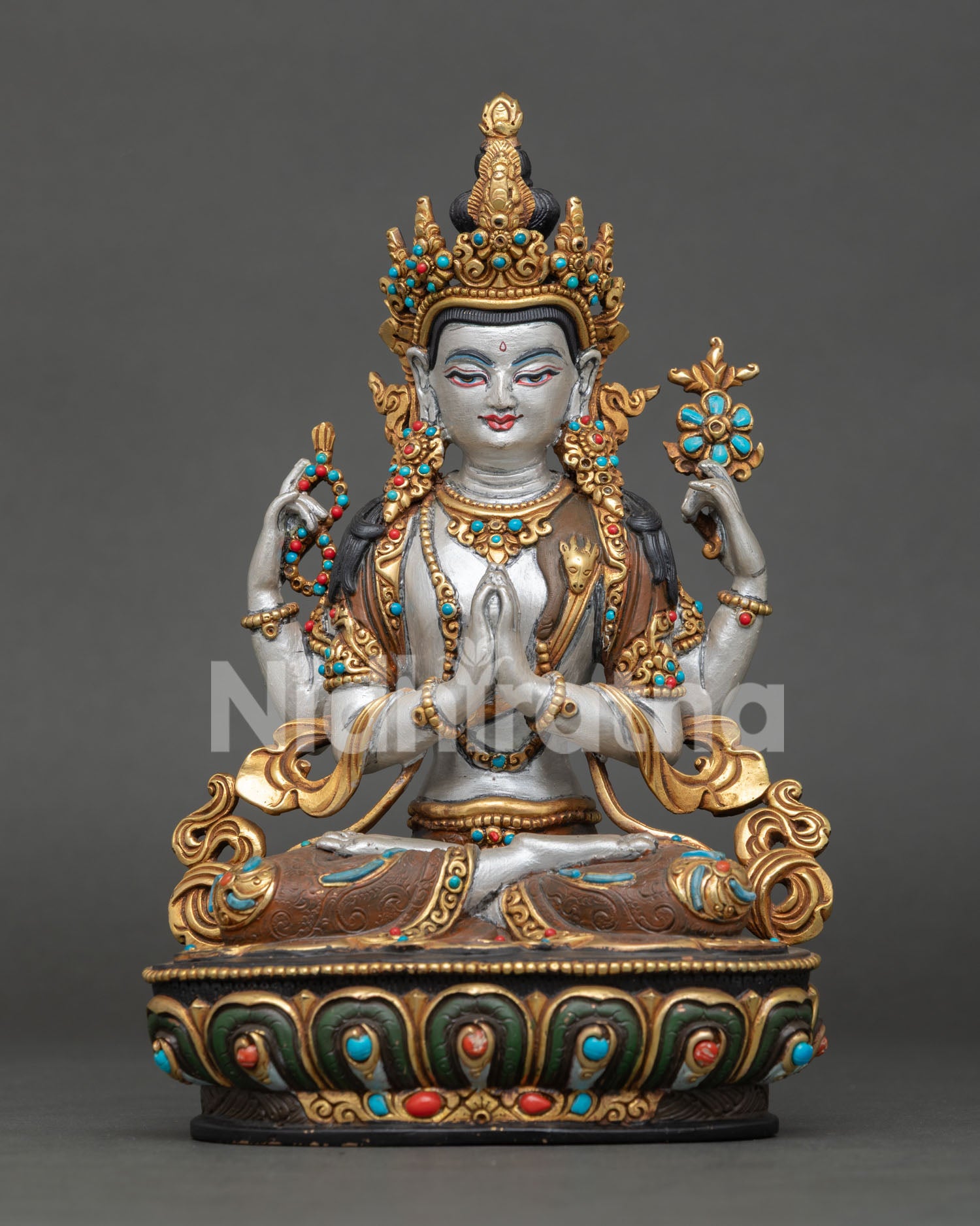 Chenrezig statue with four arms, gold gilding, and semi precious stone adornments