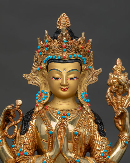 Chenrezig face with gold-painted details, turquoise, and coral stones.