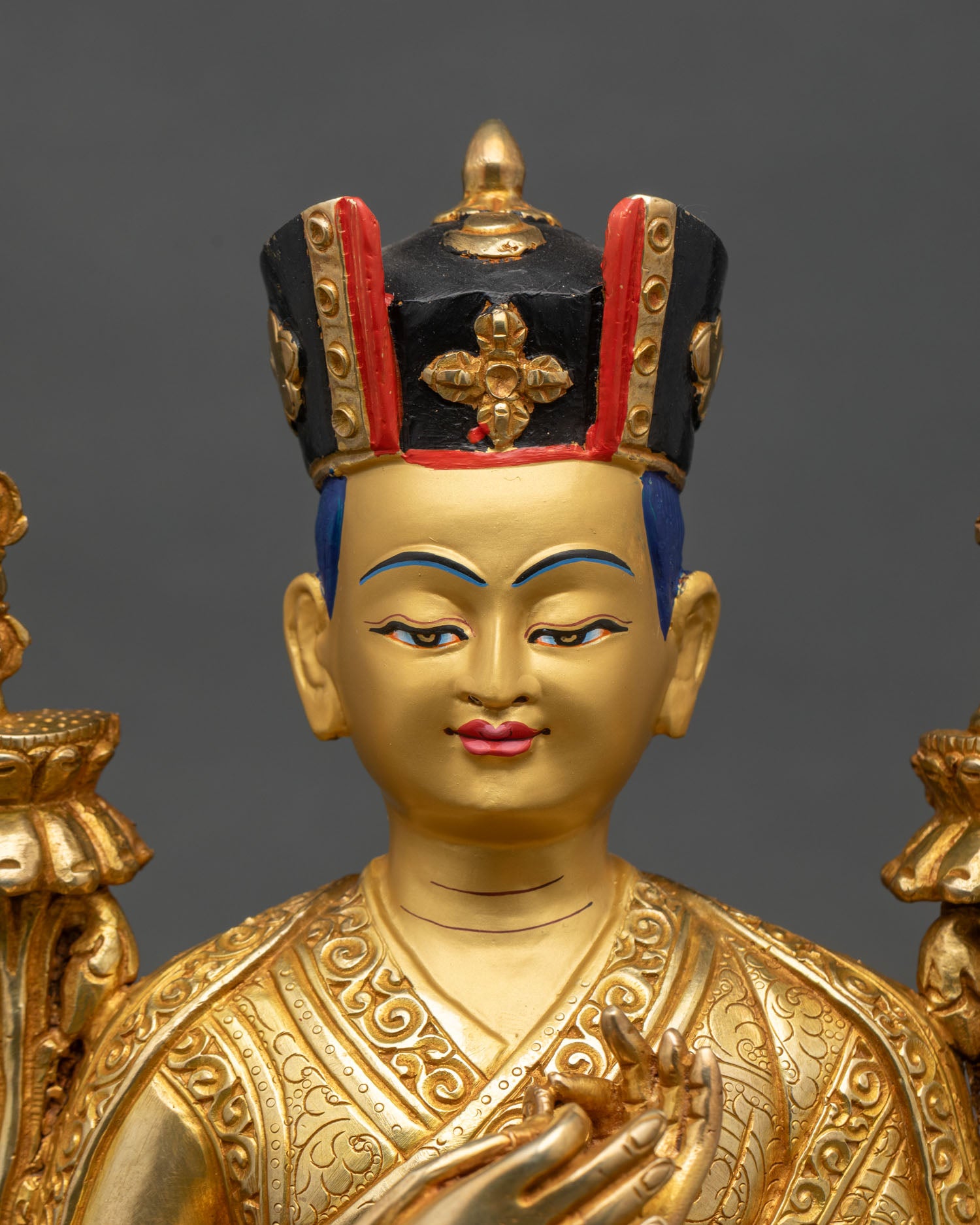 Close-up of 3rd Karmapa statue showing gold gilding and intricate robe details
