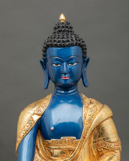 close up Deep Blue Shakyamuni Buddha statue serene face gold painted detailing semi precious stones meditation