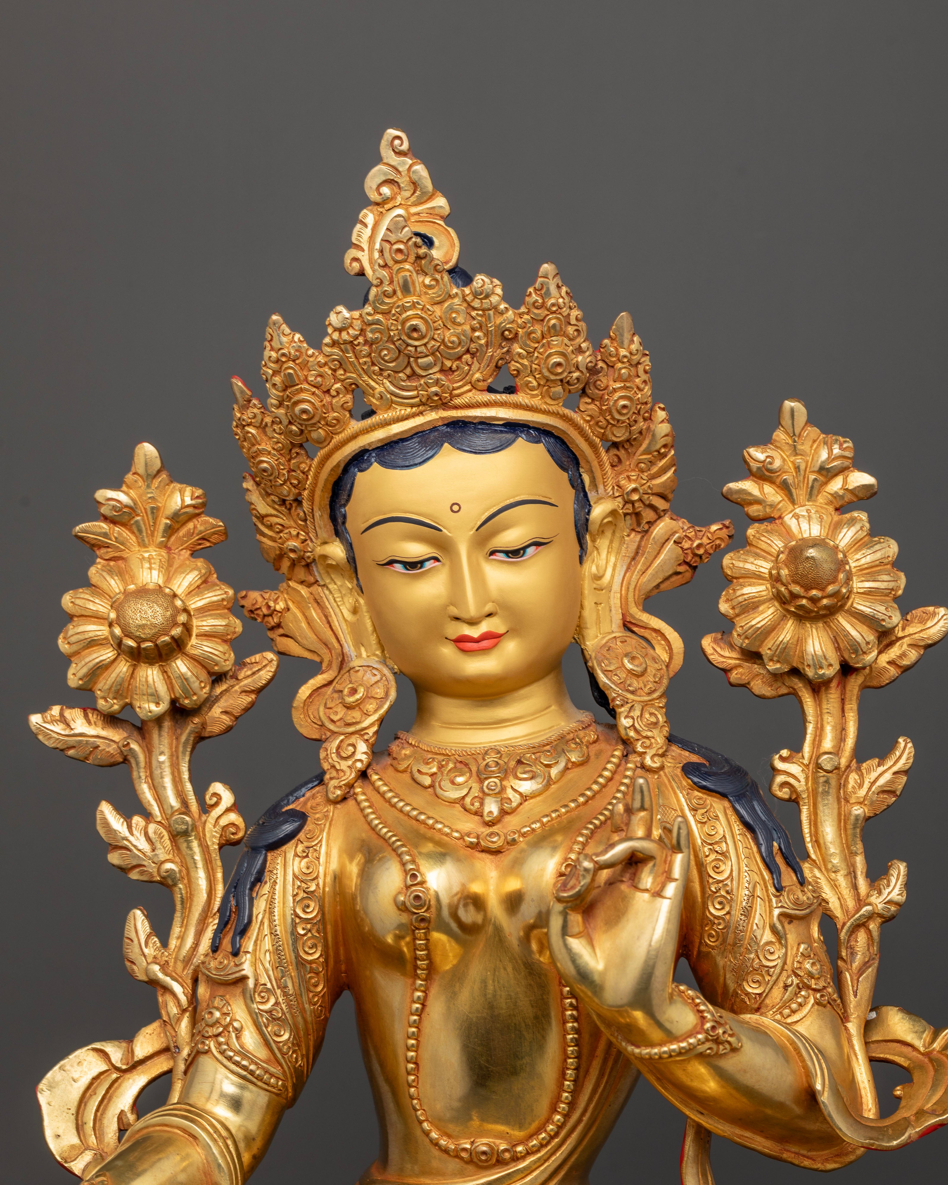 close up Green Tara statue gold painted face five jewelled crown Newari artisan