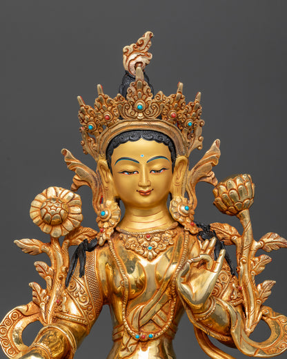 close up Green Tara statue gold painted face semi precious stones crown Himalayan Buddhist sculpture