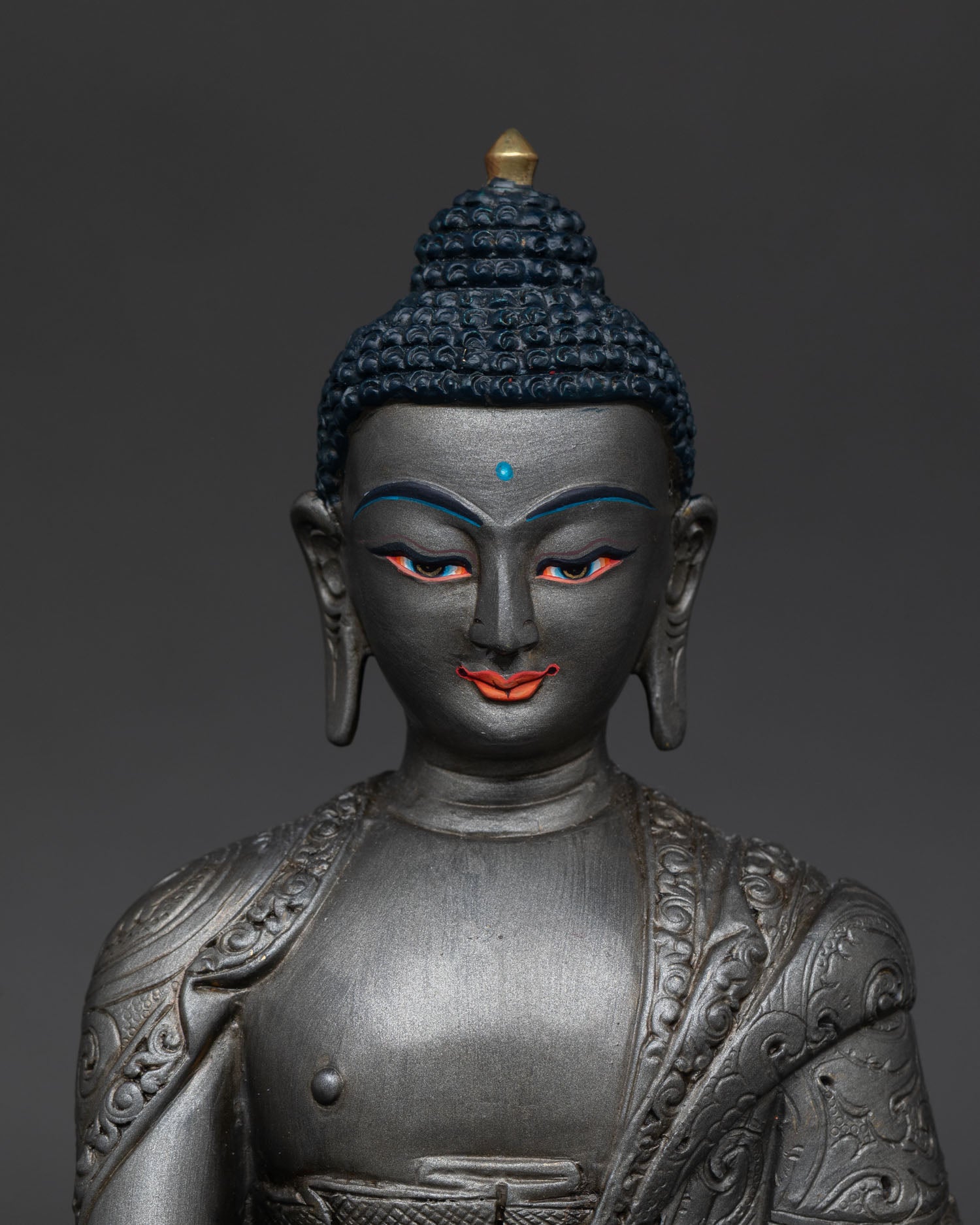 Close up Akshobhya Buddha statue detailed monk robe copper alloy vajra symbol sacred craftsmanship Nepal