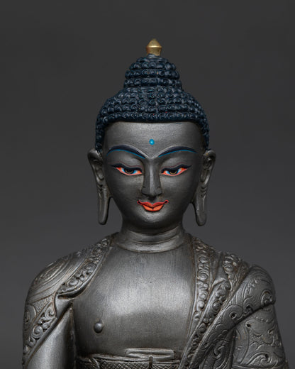 Close up Akshobhya Buddha statue detailed monk robe copper alloy vajra symbol sacred craftsmanship Nepal