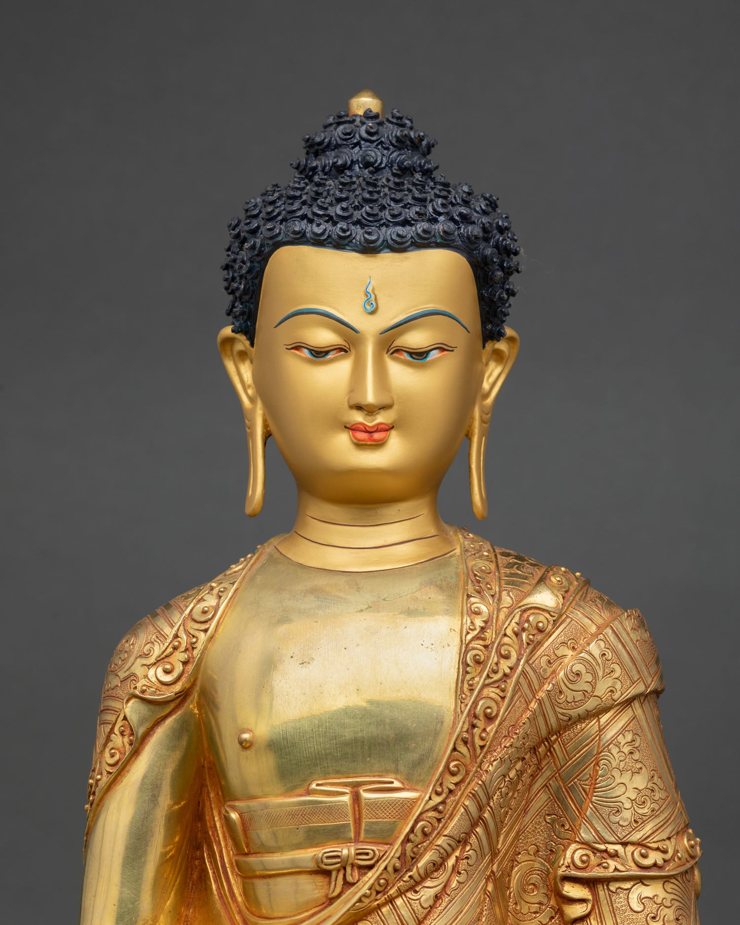 Close up Amitabha Buddha face with hand painted gold detail