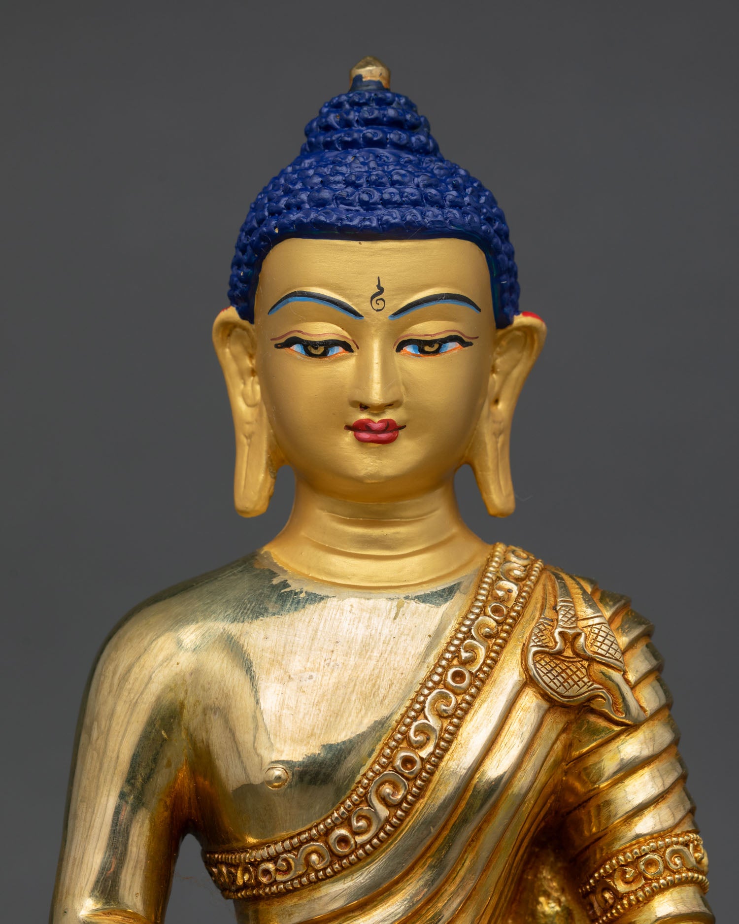 Close up Amitabha Buddha, serene gold painted face detail, copper statue with 24K gold gilding, Himalayan Buddhist craftsmanship