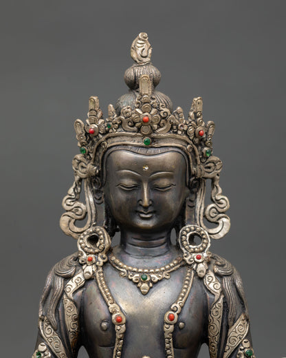 Close up Amitayus Buddha statue showing serene meditation expression and intricate Newari craftsmanship with detailed ornaments