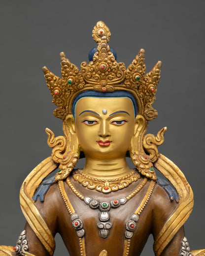 Close up Amitayus face gold painted serene expression five jeweled diadem semi precious stones detailed Himalayan artisan Buddhist statue