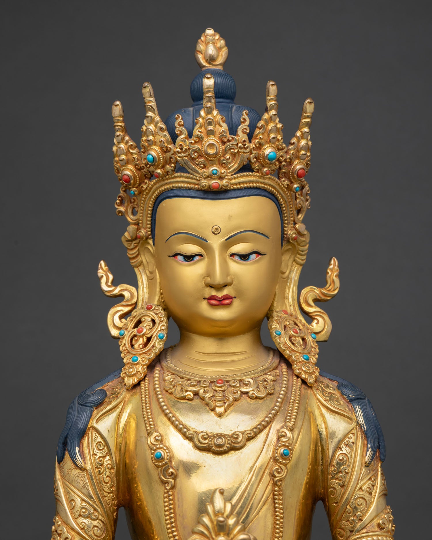 close up amitayus statue intricate copper carving 24k gold fire gilded detailing