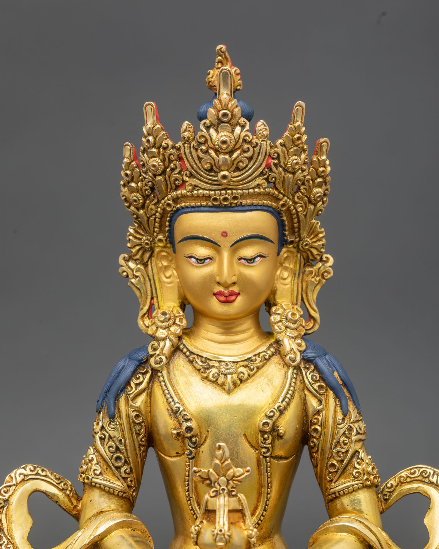 Close up of Amitayus statue, serene face, jeweled crown, Bodhisattva