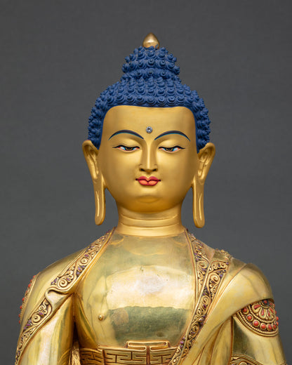 Close up Bhaisajyaguru Buddha face detail serene gold painted expression, Patan handcrafted Buddhist deity