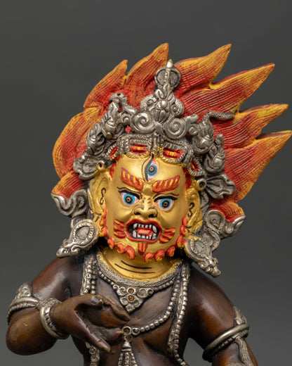 Close up Black Dzambhala face detail third eye gold painted expression, sacred Buddhist iconography wealth deity sculpture, Himalayan art Patan Nepal