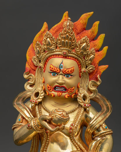 Close up view of Black Dzambhala face gold details semi precious stones Nepali Buddhist statue