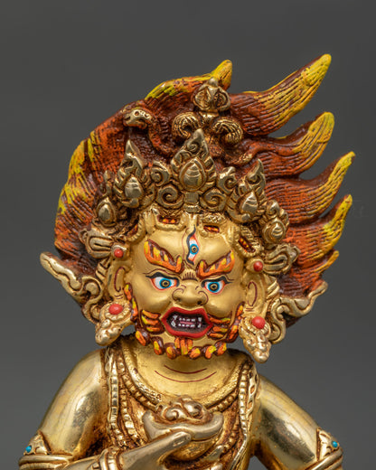 Close up Black Dzambhala face with gold painted details and semi precious stones Himalayan Buddhist handcrafted statue