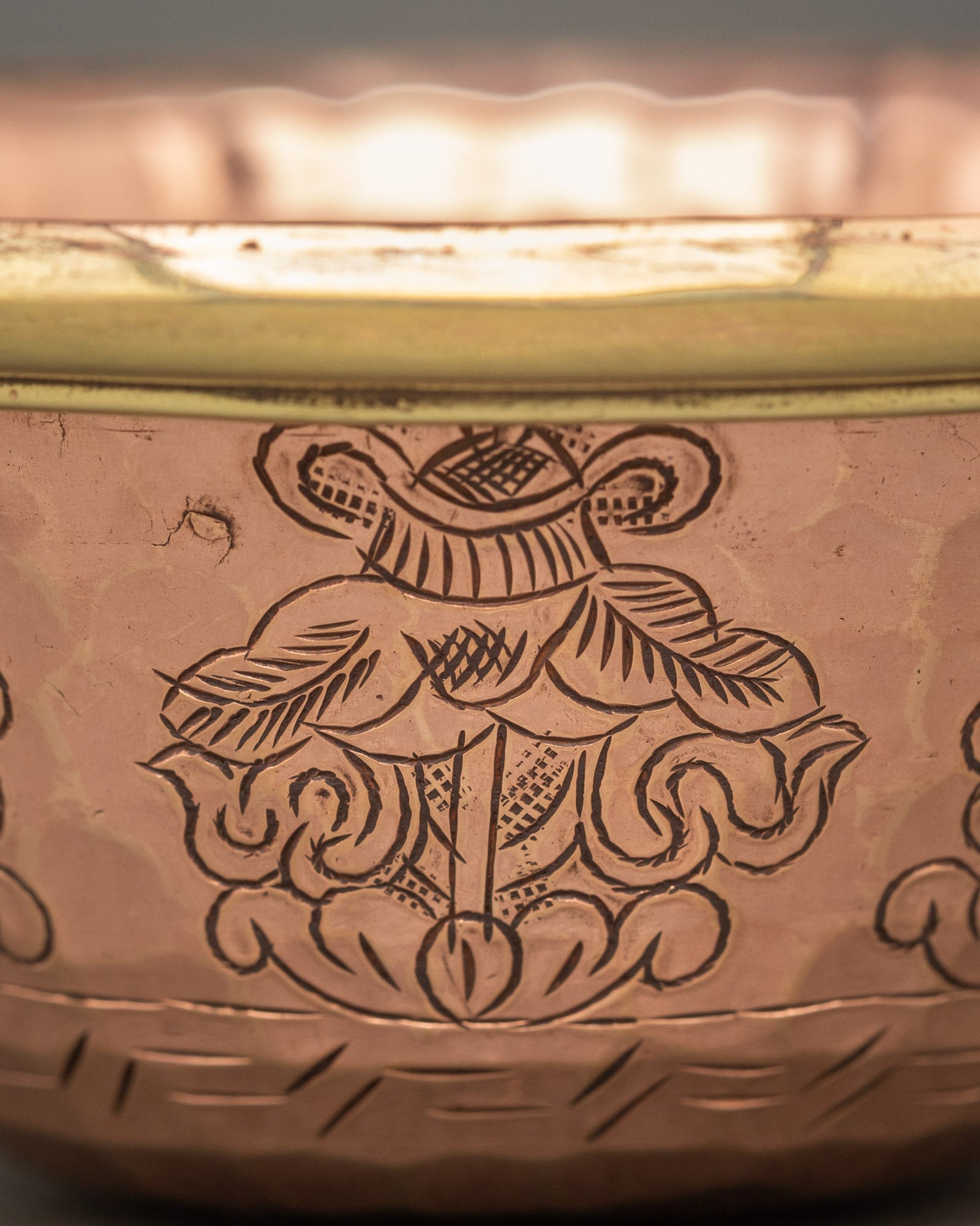 Close up bowl engraved with auspicious floral scrollwork by Newari artisans from Patan Nepal
