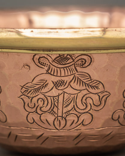 Close up bowl engraved with auspicious floral scrollwork by Newari artisans from Patan Nepal