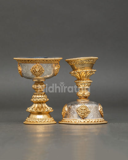 close up butter lamp detail auspicious symbols engraved gold plated vessel sacred offering lamp buddhist art