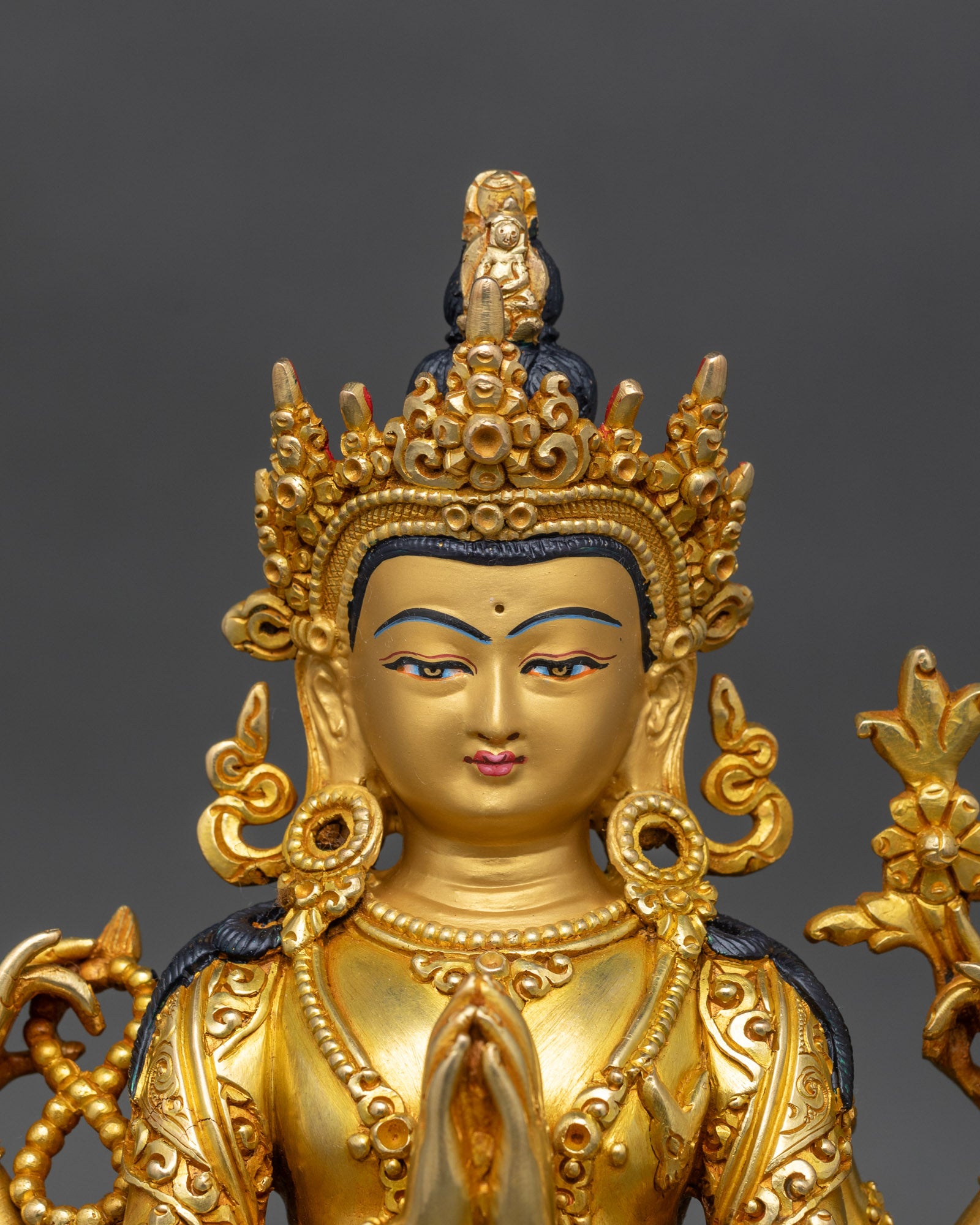 close-up-chenrezig-face-handcrafted-nepal-buddhist-statue-gold-painted-detail