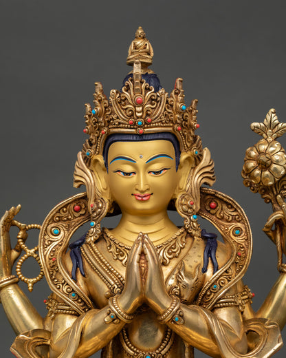 Close-up, Chenrezig statue, hand-painted golden face, semi-precious stones, four arms holding rosary, lotus, and wish-fulfilling jewel 