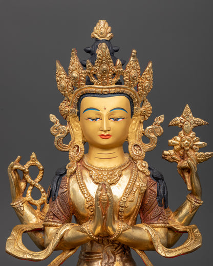 Close up of Chenrezig statue showing serene 24K gold painted face and intricate Newari details.