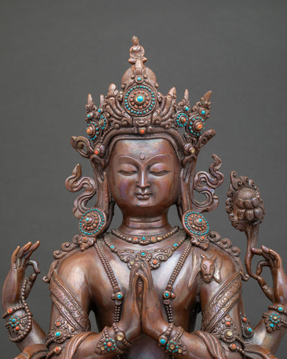 Close up Chenrezig statue showing serene face jewel crown and intricate copper details.