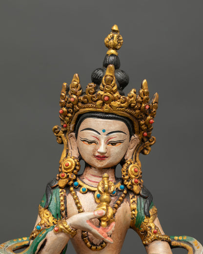 Close up detail of Vajrasattva face and crown showing intricate Nepalese Newari craftsmanship hand painted colors and spiritual expression