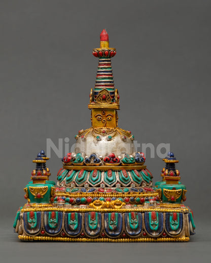 Close up detailed view of Tibetan Stupa showing turquoise coral lapis lazuli malachite inlays, gold gilded sacred Buddhist monument from Kathmandu Valley craftsmanship