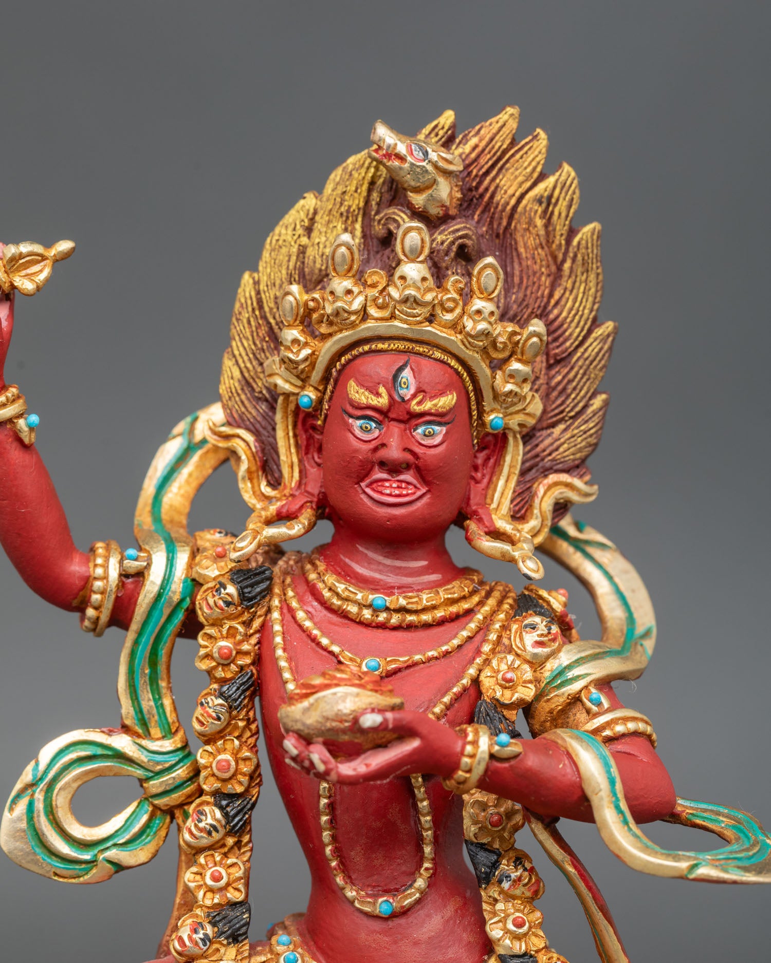 Close up dorje phagmo vajravarahi buddhist dakini face with semi precious stones