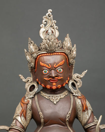 Close up Dzambhala face detail hand painted acrylic colors radiant expression Buddhist wealth god mongoose citron fruit sacred Himalayan art