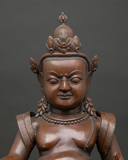 close up dzambhala statue copper oxidized detail handcrafted buddhist wealth deity art