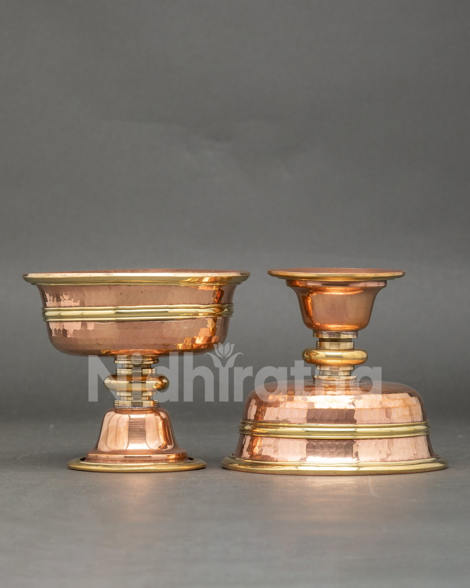 Close up engraved small two butter lamps copper handcrafted Tibetan ritual set